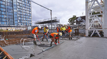 Construction workers performing a slab pour