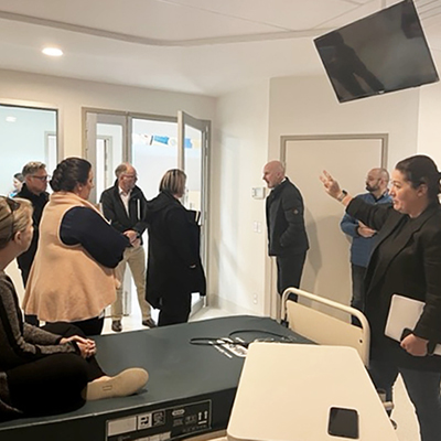 Representatives exploring a prototype of the double inpatient room.