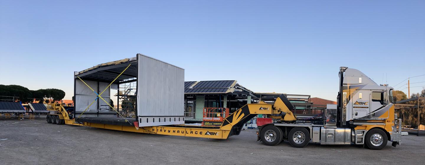 A truck transporting a construction module