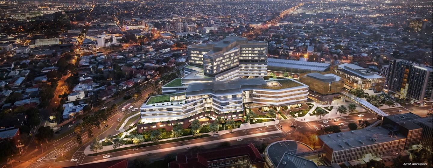 Aerial artist impression of the new Footscray Hospital at night lit up