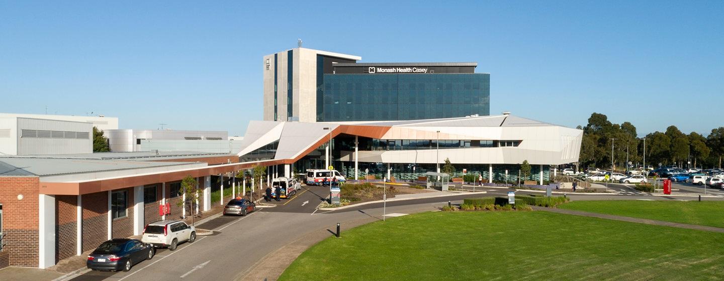 Hospital building with sign Monash Health Casey