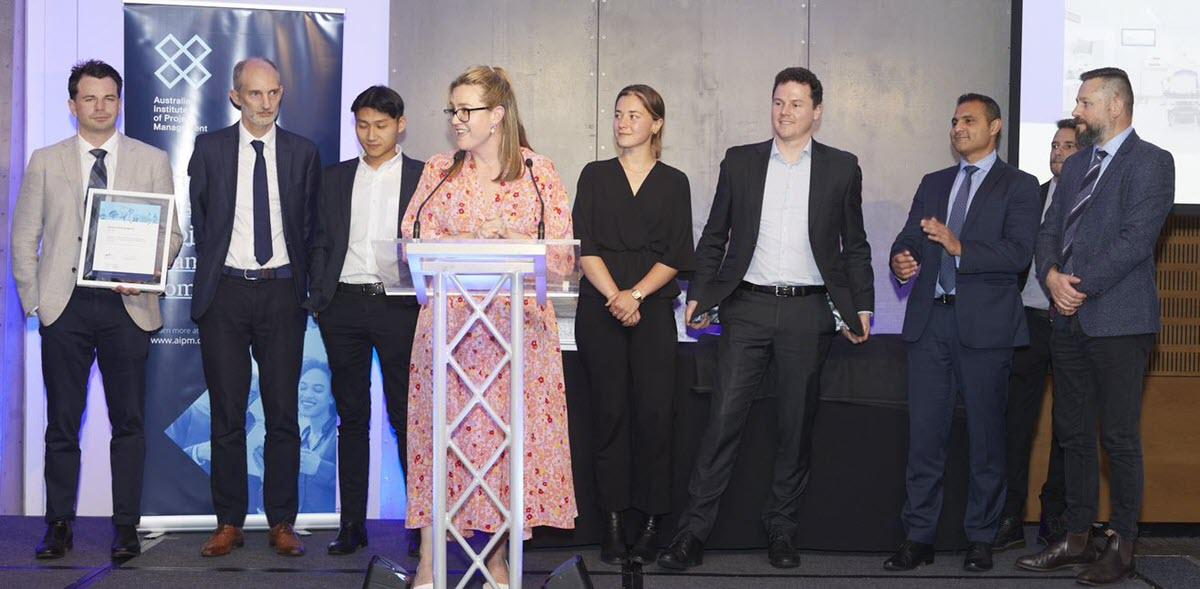 A row of people accepting an award