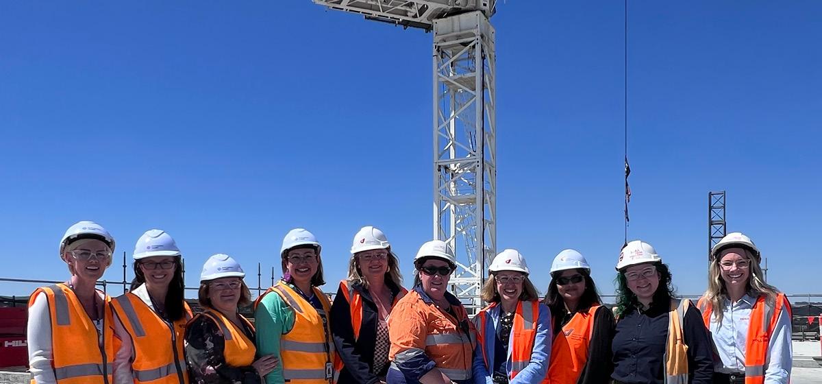  group of women in hard hats onsite at the Ballarat Base Hospital redevelopment construction site.