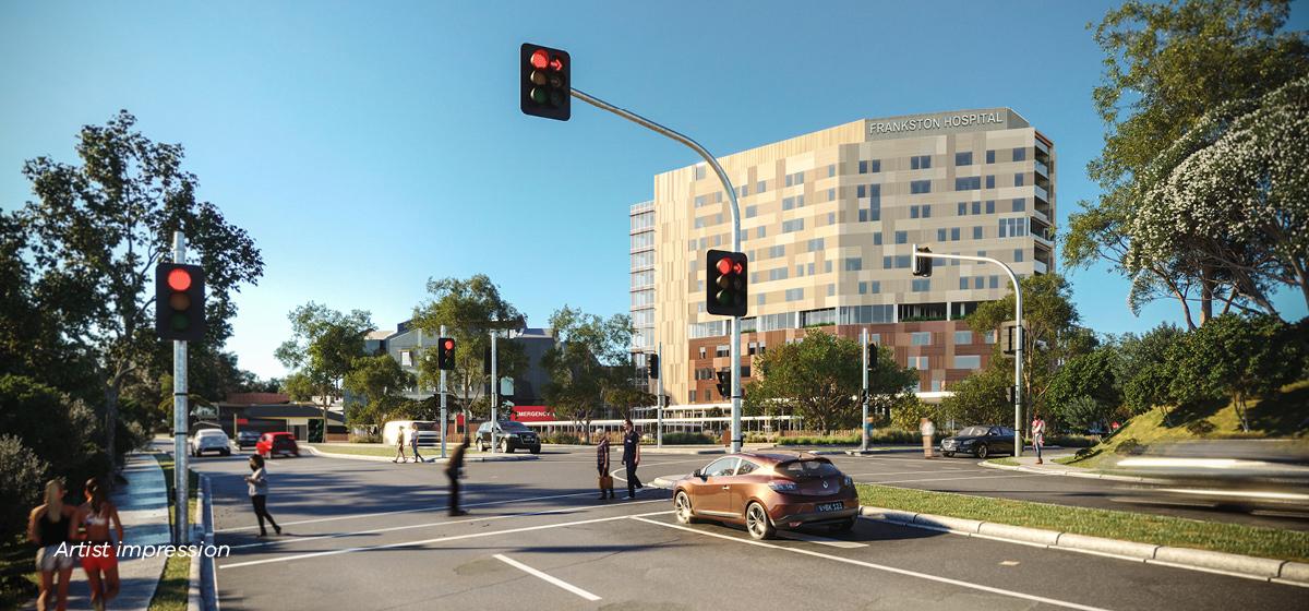 Artist impression of an intersection with three lanes and traffic lights, with Frankston Hospital visible in the background