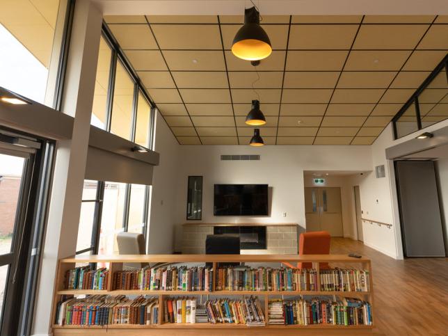 Image of interior at Edenhope and Memorial District Hospital aged care facility - including bookcase and fireplace.