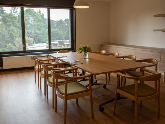 Long table room of Creswick Nursing Home Dementia Friendly Unit showing 10 seat table in front of large window