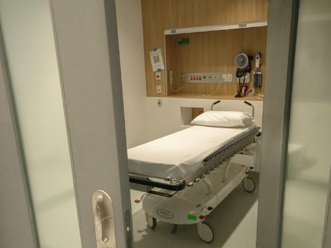 View of Emergency Department Cubicle from outside doors showing single bed/gurney