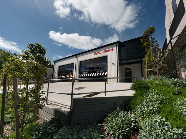 A view of the Kew ambulance branch from the front showing a driveway and gardens