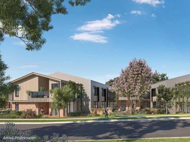 Street view of the Camperdown aged care facility. There is a large tree and a road in the front of the building.