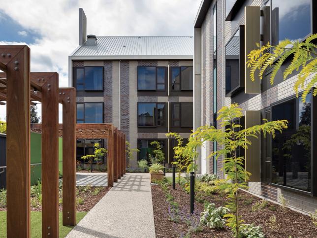 Landscaped courtyards that are surrounded by glass buildings at the St Georges Hospital