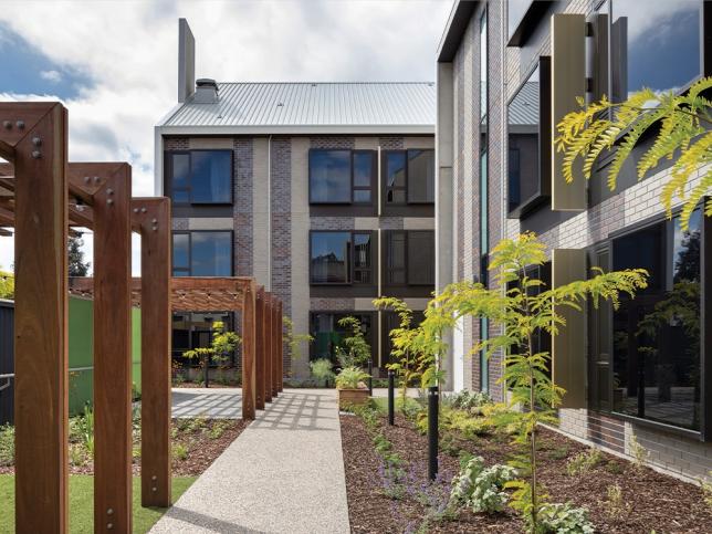 Landscaped courtyards that are surrounded by glass buildings at the St Georges Hospital