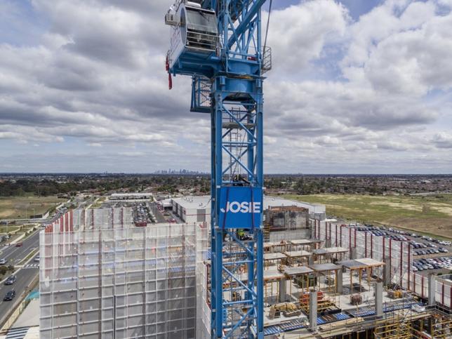 Wide shot aerial view of construction and a crane at the Northern Hospital. The crane says 'Josie'