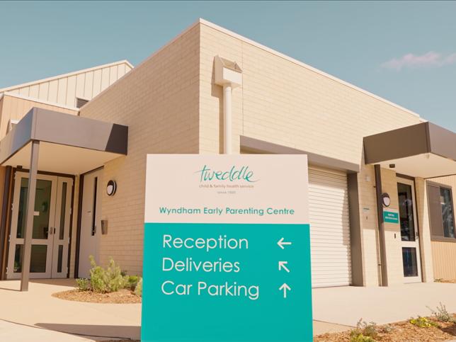 The entrance to the Wyndham Early Parenting Centre. There is a green and white sign with directions.