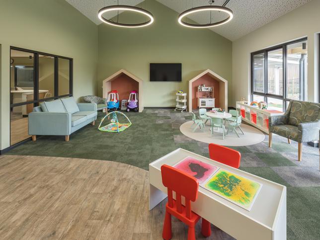 Play equipment and couches in one of the interior rooms