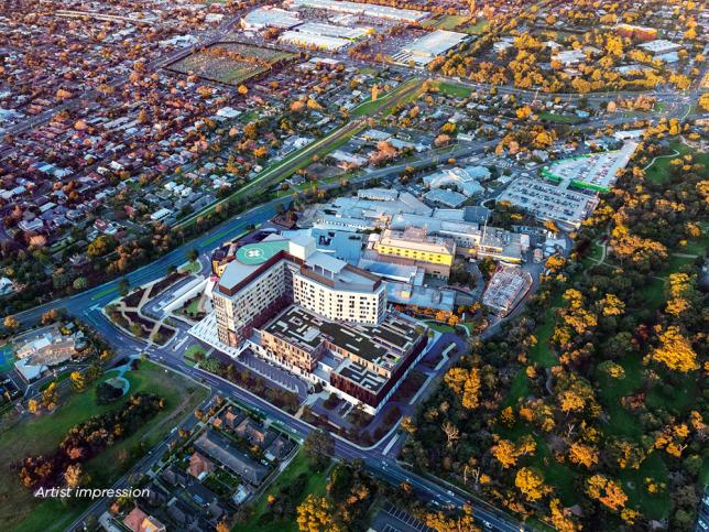 Aerial artist impression shows hospital with trees and carpark nearby