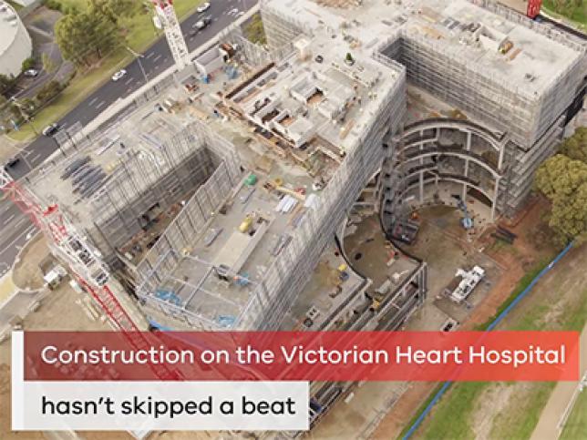 The Victorian Heart Hospital from above during construction. Text reads 'Construction on the Victorian Heart Hospital hasn't skipped a beat'