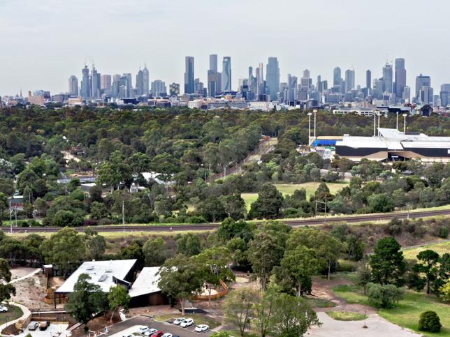 A mental health facility with parklands and the Melbourne CBD in the background