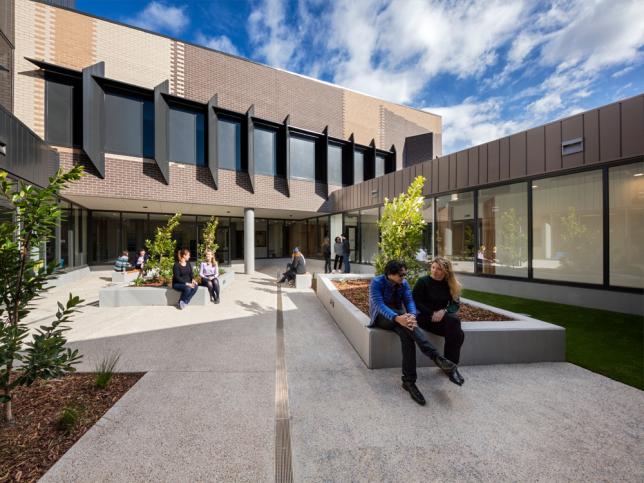 People sitting in an outdoor courtyard