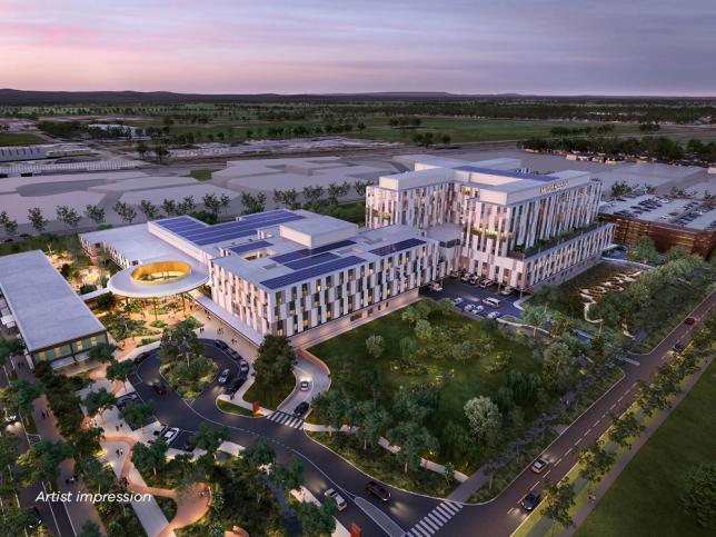 Artist impression of an aerial view of the exterior of New Melton Hospital, seen in the evening with lighting turned on