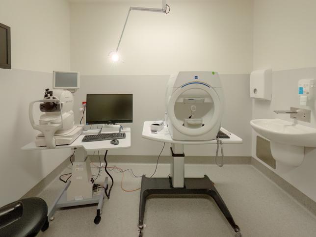 A white room with large medical machines