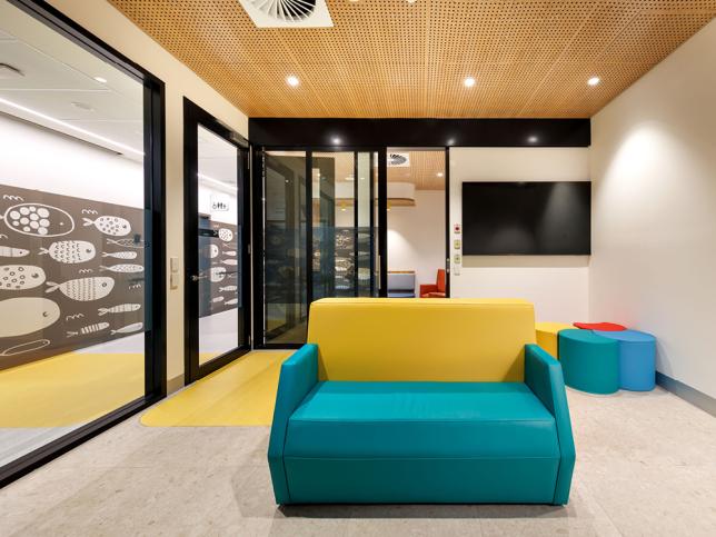 Yellow and blue couch in paediatric waiting room