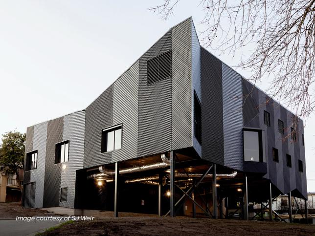 A modern and grand black and grey building