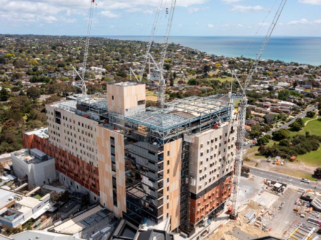 An aerial view of the hospital with an expansive view of Port Phillip Bay in the background