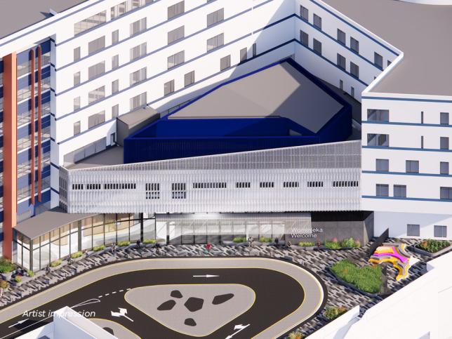 Artist impression of an external aerial view of a hospital entrance. The building has a white facade and there is a roundabout outside the entrance.