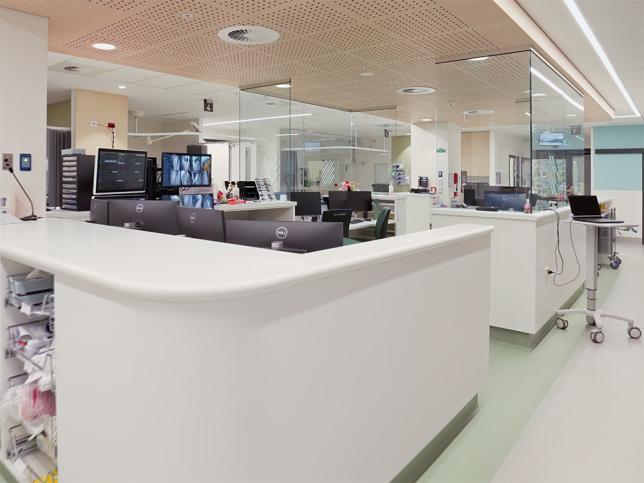 A professional and clean looking area with bright white desks