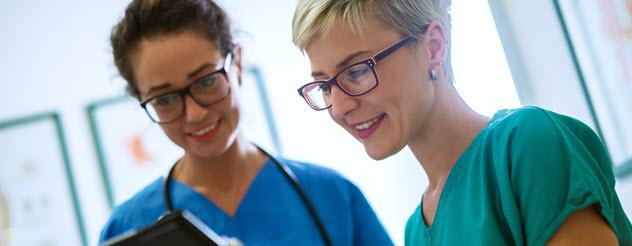 Medical staff looking at a clipboard