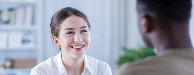 Image of a young woman with dark hair smilling