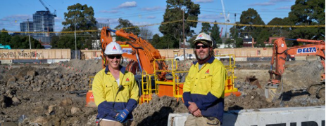 Two workers at a construction site