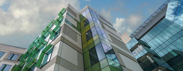 Artist impression of the Royal Children's Hospital. An upward view of a green and purple building.