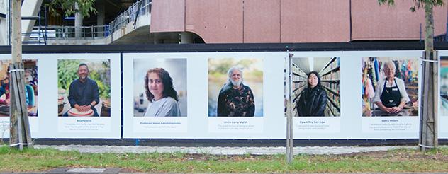 A board with portraits of some of the participatins of the 'Faces of Footscray' exhibition at the New Footscray Hospital