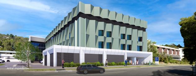 An artist impression of an exterior view of the Angliss Hospital expansion from Edward Street. The building has a green facade with a white exterior on the ground floor.