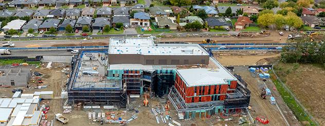 An aerial view of the construction site for Cranbourne Community Hospital, with the building surrounded in scaffolding