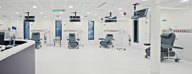 A clean and modern space with white flooring and walls and hi-tech equipment.